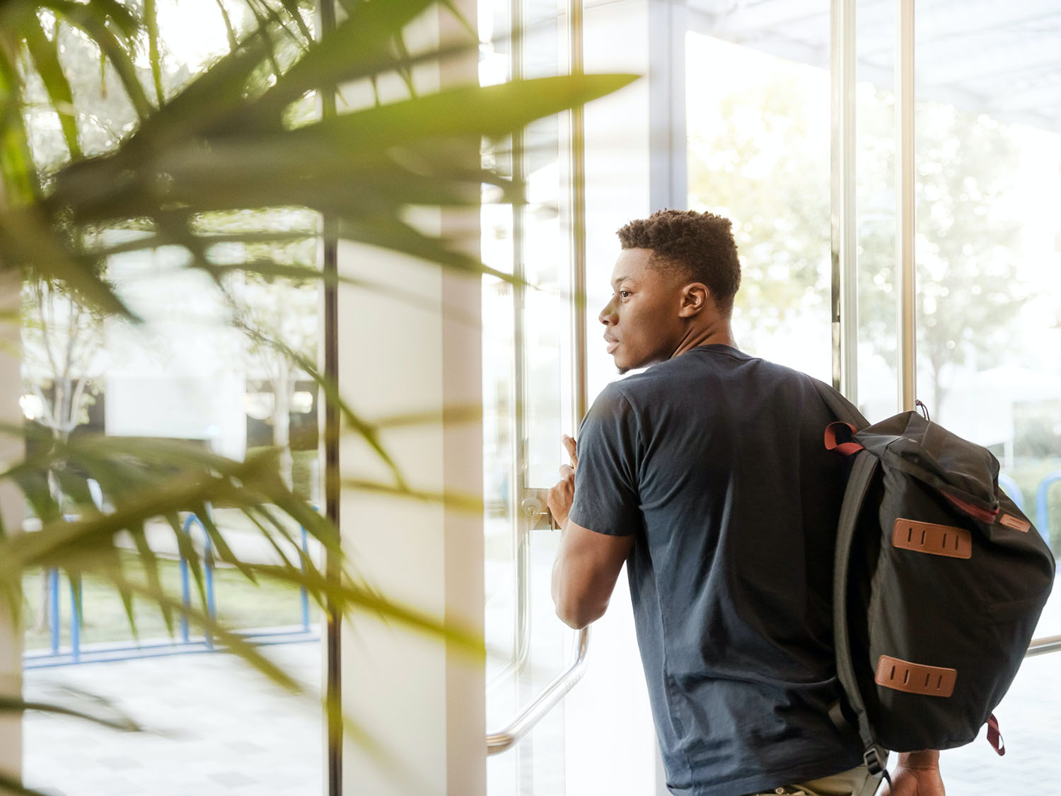 Student opening a door